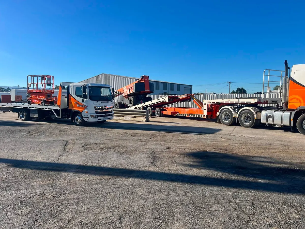 A Beecheys Towing flatbed loaded for a highway run