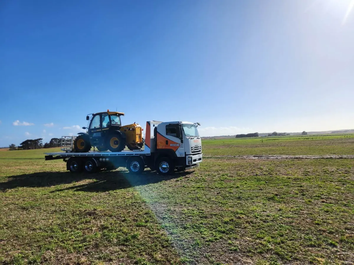 A Beecheys Towing truck on a wet Tasmanian road