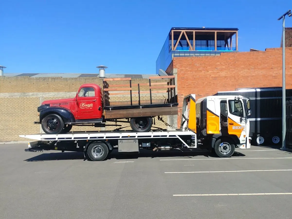 A Beecheys Towing flatbed on the road near Launceston