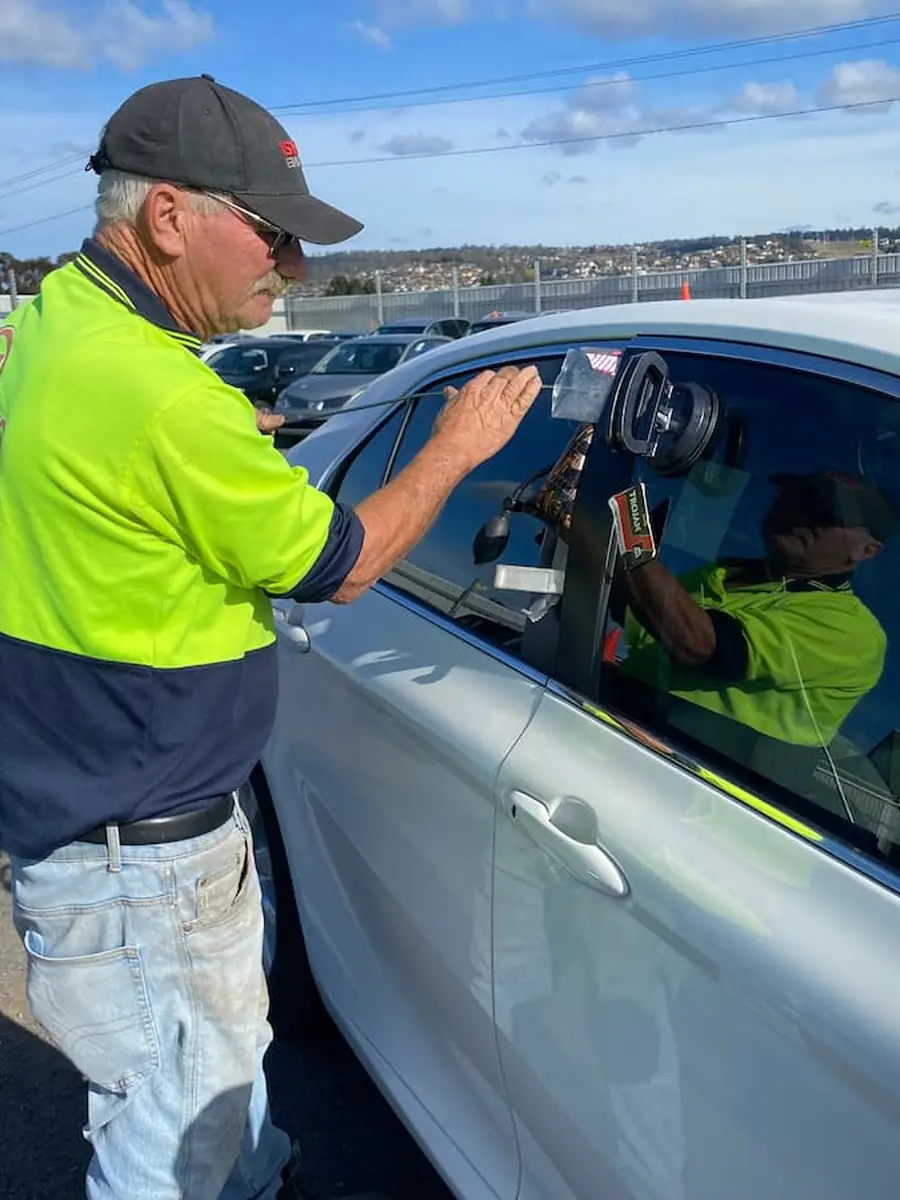 Beecheys Towing crew member helping a customer back into a locked vehicle
